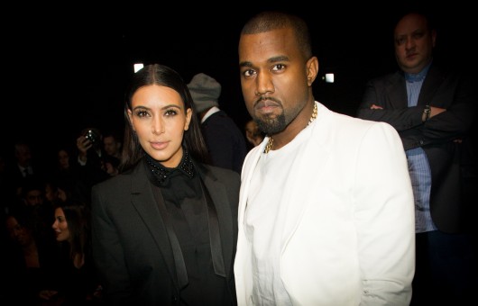 Kim Kardashian (left) and Kanye West at the Givenchy Fall-Winter 2013/2014 Ready-To-Wear collection show on March 3. The two became engaged Oct. 21.  Credit: Courtesy of MCT 