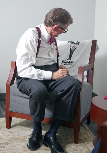 OSU President Emeritus E. Gordon Gee looks at a shirt during an interview with The Lantern Oct. 21. Credit: Shelby Lum / Photo editor