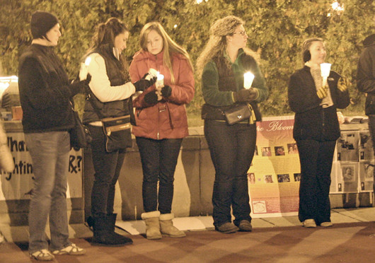 OSU students light candles in memory of people who died from prescription drug overdoses during a vigil Oct. 24 at Browning Amphitheater. Credit: Michele Theodore / Copy chief