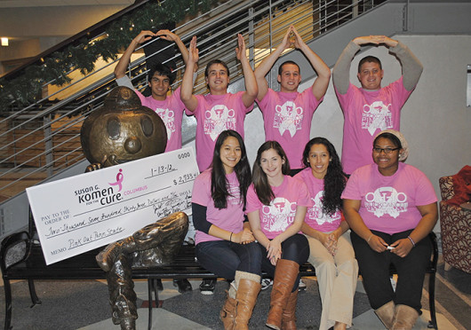Members of Pink Out at Ohio State pose with a check for nearly $3,000 to be donated to Susan G. Komen for the Cure Jan. 13, 2012. Credit: Courtesy of Jim Ellia