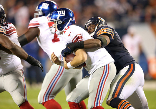 Chicago Bears linebacker Lance Briggs (right) sacks New York Giants quarterback Eli Manning at Soldier Field Oct. 10. The Bears won, 27-21. Credit: Courtesy of MCT