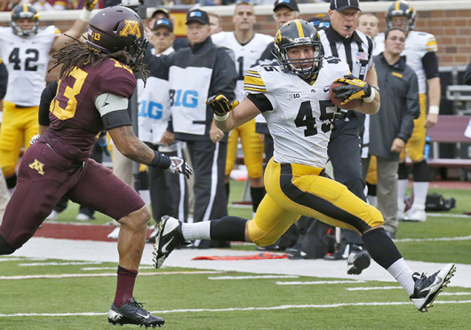 Iowa running back Mark Weisman (45) rushes down the field during a game agianst Minnesota at TCF Bank Stadium Sept. 28. Iowa won, 23-7. Credit: Courtesy of MCT