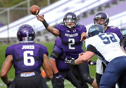 Quarterback Kain Colter (2) of Northwestern throws to Tony Jones (6) for a 27-yard touchdown in the first quarter against Maine at Ryan Field Sept. 21. Northwestern won, 35-21. Credit: Courtesy of MCT