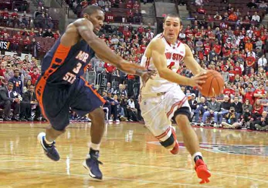 Senior guard Aaron Craft (4) drives to the basket during a game against Morgan State Nov. 9 at the Schottenstein Center. OSU won, 89-50. Credit: Shelby Lum / Photo editor