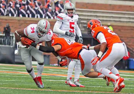 Senior running back Carlos Hyde (34) is hit by a defender during a game against Illinois Nov. 16 at Memorial Stadium. OSU won, 60-35. Credit: Shelby Lum / Photo editor