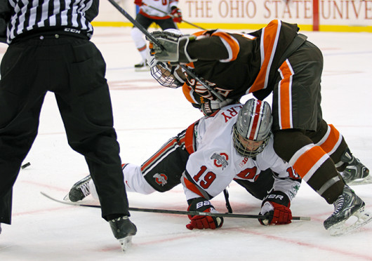 Junior forward Chad Niddery fights for the puck during a game against Bowling Green Oct. 29 at the Schottenstein Center. OSU won, 5-3. Credit: Shelby Lum / Photo editor