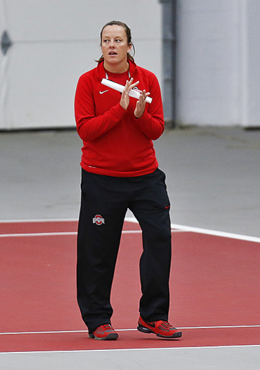 OSU women's tennis coach Melissa Schaub watches the Buckeyes during a match against Michigan April 21 at the Varsity Tennis Center. OSU lost, 7-0. Credit: Courtesy of the OSU Athletic Department