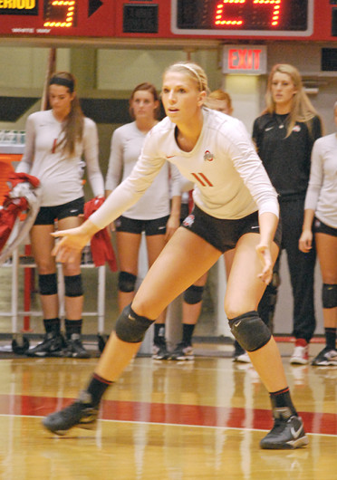 Senior outside hitter Kaitlyn Leary (11) gets set before a serve during a match against Illinois Nov. 22 at St. John Arena. OSU lost, 3-1. Credit: Tim Moody / Lantern reporter