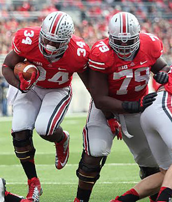 Then-redshirt-junior right guard Marcus Hall (79) blocks for then-junior running back Carlos Hyde (34) during a game against Illinois Nov. 3, 2012, at Ohio Stadium. OSU won, 52-22. Credit: Lantern file photo