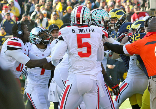 Dontre Wilson (1) and other Buckeye players fight with Michigan players during a game Nov. 30 at Michigan Stadium. OSU won, 42-41. Credit: Ritika Shah/ Asst. photo editor