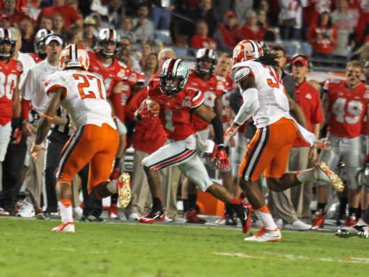 Freshman running back Dontre Wilson avoids defenders during the 2014 Discover Orange Bowl Jan. 3 at Sun Life Stadium. OSU lost, 40-35. Credit: Shelby Lum / Photo editor