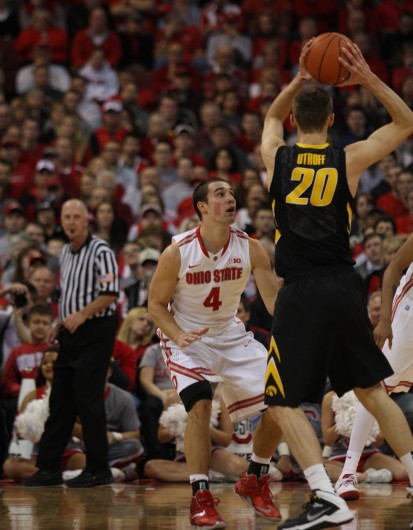 Senior guard Aaron Craft (4) defends and Iowa player during a game Jan. 12 at the Schottenstein Center. OSU lost, 84-74. Credit: Shelby Lum / Photo editor