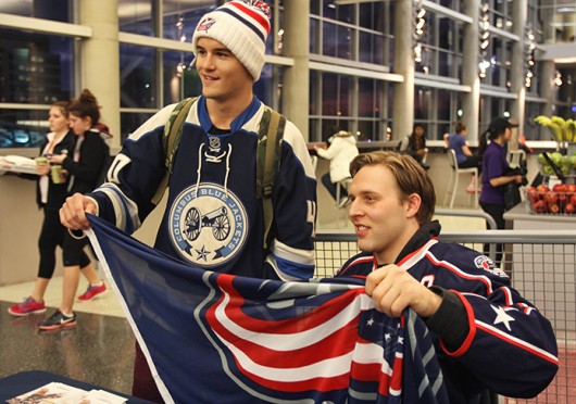 Columbus Blue Jackets defenseman Jack Johnson (left) poses for a photo with first year in exploration Brent Savan. Johnson was signing autographs Jan. 15 at the RPAC. Credit: Shelby Lum / Photo editor