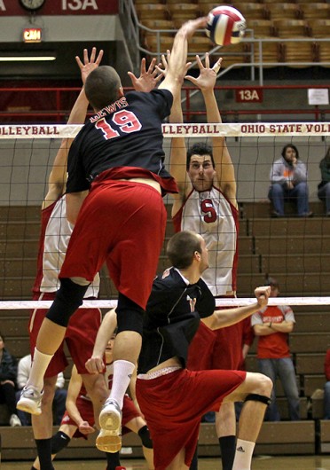 Then-sophomore middle blocker Grayson Overman attempts to block an opposing spike during a match against Lewis March 4, 2011, at St. John Arena. OSU won, 3-0. Credit: Cody Cousino / For The Lantern
