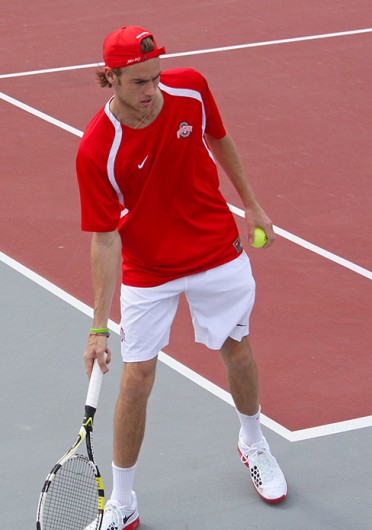 Then-redshirt-sophomore Hunter Callahan bats a ball away during a match against Minnesota April 7 at the Varsity Tennis Center. OSU won, 7-0. Credit: Caitlin Essig / Managing editor for content