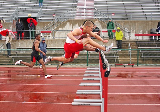 Then-redshirt-sophomore Cory Kunze jumps over a hurdle during the Jesse Owens Track Classic April 14, 2012, at Jesse Owens Memorial Field. Credit: Shelby Lum / Photo editor