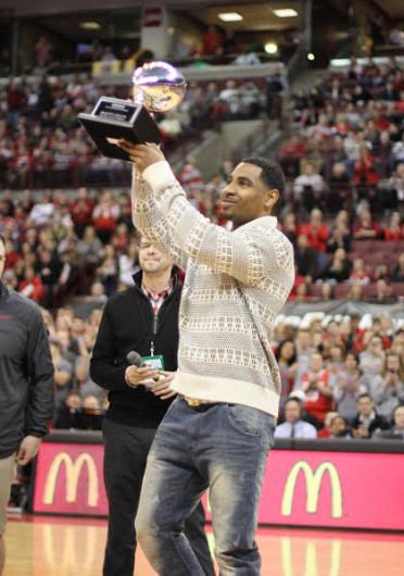 Junior quarterback Braxton Miller lifts the Silver Football, awarded to the Big Ten's football MVP Feb. 20 at the Schottenstein Center. Credit: Shelby Lum / Photo editor