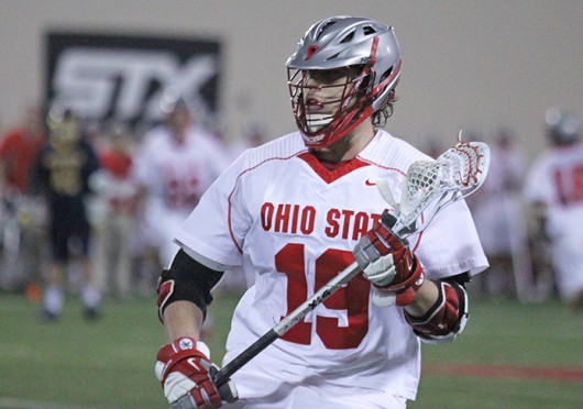 Junior midfielder Jesse King (19) cradles the ball during a game against Marquette Feb. 22 at the Woody Hayes Athletic Center. OSU won, 11-7. Credit: Brett Amadon / Lantern reporter