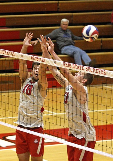 Junior middle blocker Dustan Neary (18) and freshman outside hitter Miles Johnson (13) attempt to block the ball during a match against Grand Canyon Feb. 21 at St. John Arena. OSU won, 3-0. Credit: Jonathan McAllister / Lantern photographer