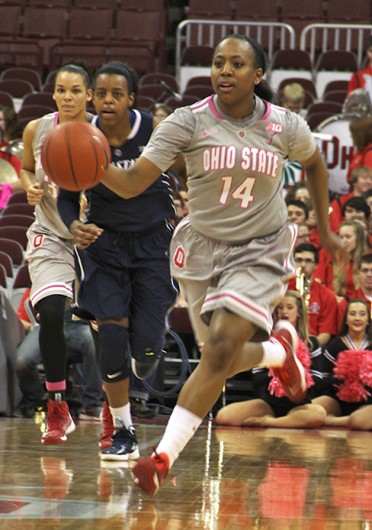 Sophomore guard Ameryst Alston (14) dribbles down the court during a game against Penn State Feb. 9 at the Schottenstein Center. OSU lost, 74-54. Credit: Ritika Shah / Asst. photo editor