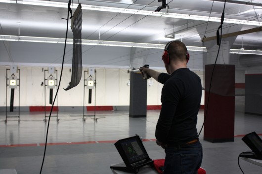 A member of the OSU pistol team lines up for a shot during practice Feb. 12 in Converse Hall at the Lt. Hugh W. Wylie Range. Credit: Nick Deibel / Lantern reporter