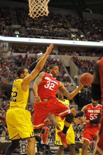 Senior guard Lenzelle Smith Jr. (32) looks to fire a pass during the Big Ten Tournament semifinals against Michigan. OSU lost, 72-69. Credit: Shelby Lum / Photo editor