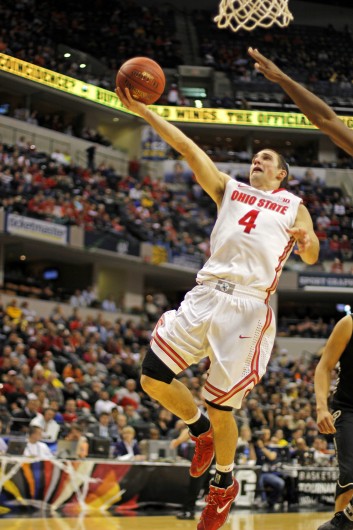 Senior guard Aaron Craft floats for a layup during a game against Purdue March 13 at Bankers Life Fieldhouse. OSU won, 63-61. Credit: Shelby Lum / Photo editor