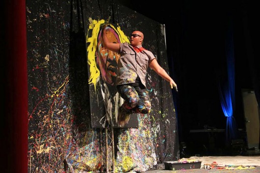 Performance painter David Garibaldi paints at the Ohio Union in an OUAB-sponsored event March 3. Credit: Ritika Shah / Asst. photo editor