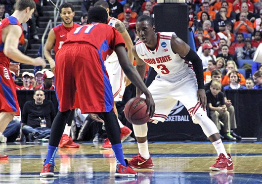 Junior guard Shannon Scott (3) sets himself on defense during a game against Dayton March 20 at First Niagara Center. OSU lost, 60-59. Credit: Ritika Shah / Asst. photo editor