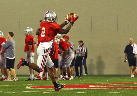 Sophomore running back Dontre Wilson (2) catches the ball during spring practice March 20 at the Woody Hayes Athletic Center. Credit: Mark Batke / For The Lantern
