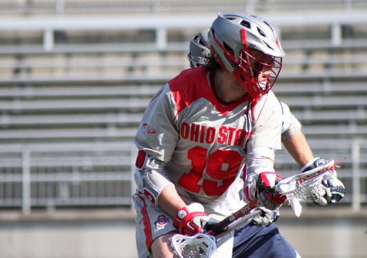 Junior midfielder Jesse King (19) looks for an open teammate during a game against Penn State March 1 at Ohio Stadium. OSU lost, 11-7. Credit: Ryan Robey / For The Lantern