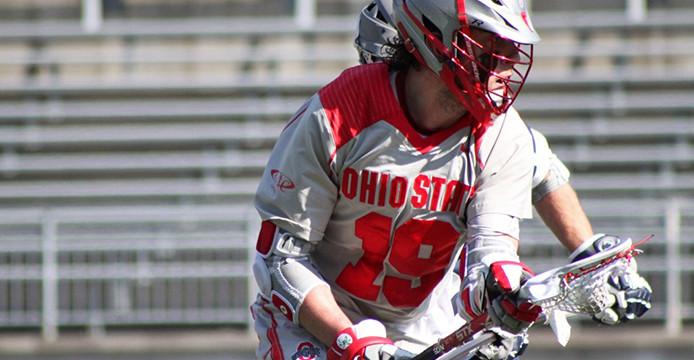 Then-junior midfielder Jesse King (19) looks for an open teammate during a game against Penn State March 1 at Ohio Stadium. OSU lost, 11-7. Credit: Lantern file photo