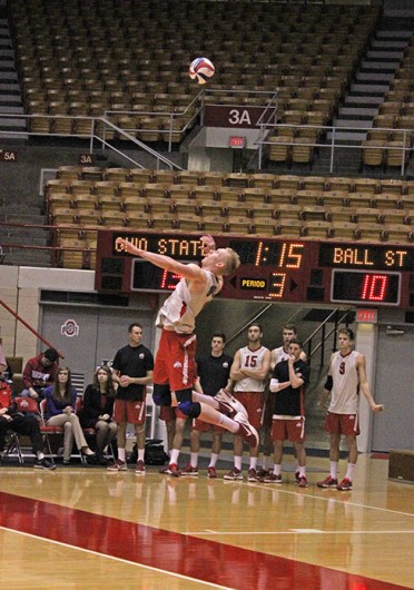 Redshirt-junior opposite Andrew Lutz attempts to serve the ball during a match against Ball State Feb. 26 at St. John Arena. OSU lost, 3-1.  Credit: Kathleen Martini / Oller reporter