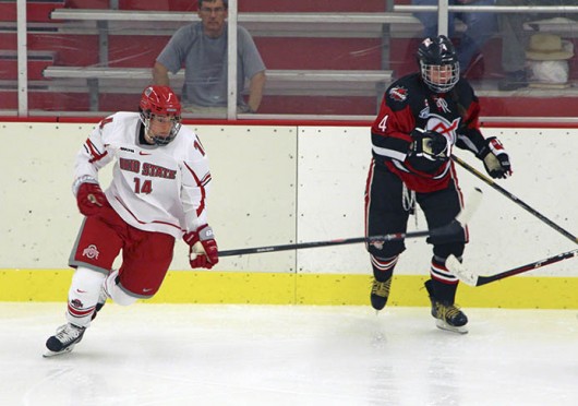 Senior defenseman Becky Allis attempts to chase down the puck during a game against the Toronto Aeros Sept. 28 at the OSU Ice Rink. OSU lost, 2-1. Credit: Chelsea Spears / Multimedia editor