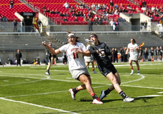 Senior attackman Katie Chase (11) handles the ball during a game against Northwestern March 9 at Ohio Stadium. OSU won, 11-10. Courtesy of OSU Athletics 