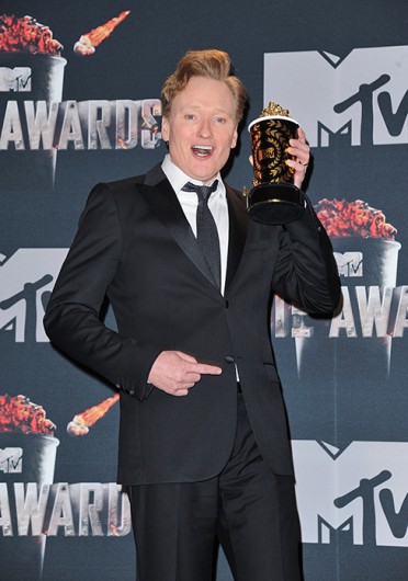 Host Conan O'Brien holds one of the awards as he poses in the press room during the 2014 MTV Movie Awards.Credit: Courtesy of MCT