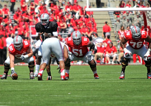 Junior center Jacoby Boren (50) and senior offensive lineman Joel Hale (51) prepare for a play during the 2014 Spring Game April 12 at Ohio Stadium. Gray beat Scarlet, 17-7. Credit: Mark Batke / For The Lantern