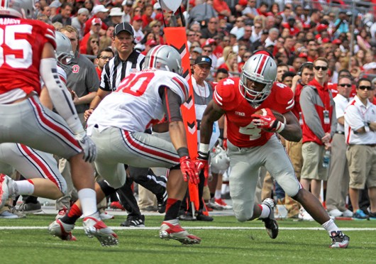 Freshman H-back Curtis Samuel (4) attempts to avoid a defender during the 2014 Spring Game April 12 at Ohio Stadium. Gray beat Scarlet, 17-7. Credit: Shelby Lum / Photo editor