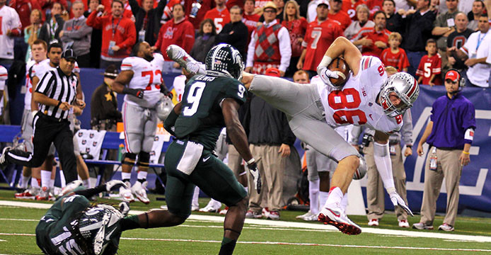 Then-junior tight end Jeff Heuerman (86) is brought down during the Big Ten Championship Game against Michigan State Dec. 7, 2013 at Lucas Oil Stadium. OSU lost, 34-24. Credit: Lantern file photo