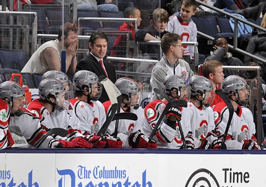 OSU hockey coach Steve Rohlik (back) talks to his team during a game against Michigan March 2 at Nationwide Arena. OSU lost, 4-3. Credit: Ben Jackson / For The Lantern
