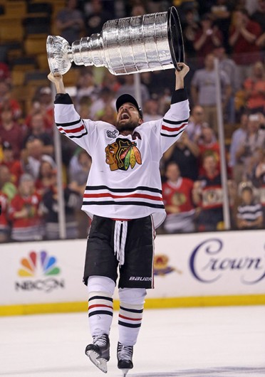 Chicago Blackhawks forward Patrick Sharp lifts the Stanley Cup after winning the trophy against the Boston Bruins June 22 at TD Bank Garden. Courtesy of MCT