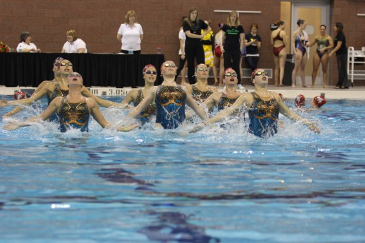 Members of the OSU Synchronized Swimming team compete during the Jessica Beck Memorial Competition Feb. 1 at McCorkle Aquatic Pavilion. The team finished 1st. Credit: Shelby Lum / Photo editor