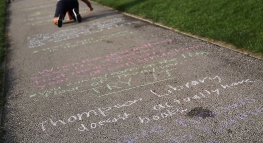 Members of OSU comedy magazine 'The Sundial' write 'the world's longest comedy list' across the Oval on Aug. 27. Credit: Muyao Shen
