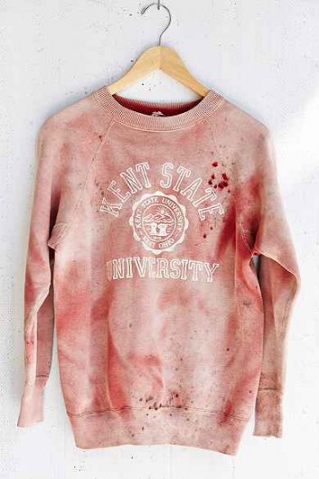 On Sept. 15, Urban Outfitters sparked controversy when a red, ‘sun-faded,’ vintage crewneck sweatshirt sporting the Kent State University logo was up for sale on the popular clothing store’s website. The sweatshirt’s blood color and bullet-like holes on the left shoulder drew connections to the May 4, 1970 shooting of four students on Kent’s campus, also known as the Kent State massacre. The store pulled the sweatshirt from its site.  Credit: Screenshot from Urban Outfitters website