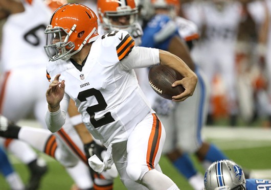 Cleveland Browns quarterback Johnny Manziel (2) evades the Detroit Lions' Kyle Van Noy (95) during the second quarter in exhibtion action on Aug. 9 at Ford Field in Detroit. Credit: Courtesy of MCT