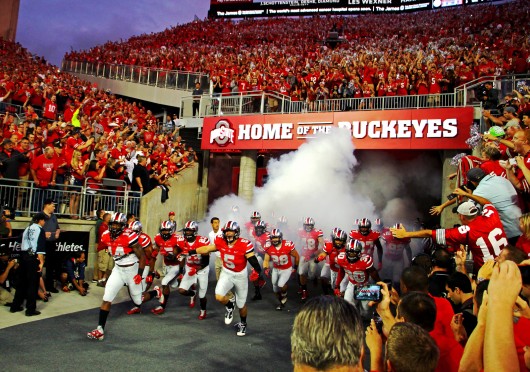 Members of the Ohio state football team run out of the new players' enterance tunnel before a matchup with Virginia Tech on Sept. 6 at Ohio Stadium. OSU los, 35-21. Credit: Mark Batke / Photo editor