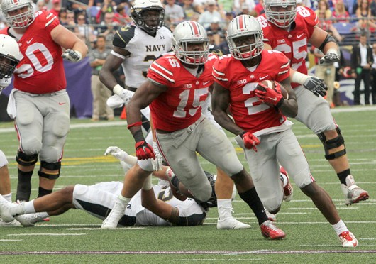 Sophomore H-back Dontre Wilson (2) carries the ball past blocks from junior offensive lineman Jacoby Boren (50), sophomore running back Ezekiel Elliott (15) and redshirt-sophomore offensive lineman Pat Elflein (65) during a game against Navy Aug. 30 at M&T Bank Stadium in baltimore. OSU won, 34-17.  Credit: Mark Batke / Photo editor