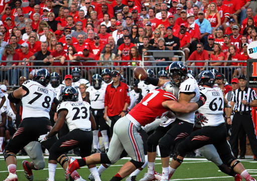 OSU sophomore defensive lineman Joey Bosa (left) forces a fumble from Cincinnati redshirt-sophomore quarterback Gunner Kiel during a Sept. 27 game at Ohio Stadium. The fumble resulted in an OSU safety. Credit: Chelsea Spears / Multimedia editor