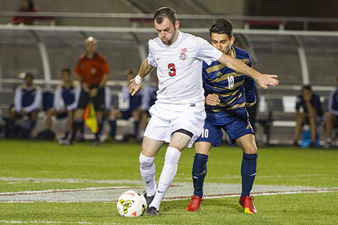 Junior defender Kyle Culbertson (3) shields an opposing player form the ball during a game against Akron on Sept. 24 at Jesse Owens Memorial Stadium. OSU lost, 3-1. Credit: Ben Jackson / For the Lantern