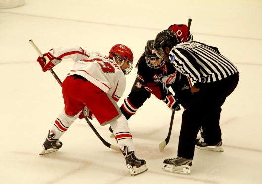 Then-freshman forward Katie Matheny (23) prepares for a face-off during a game against the Toronto Aeros on Sept. 28,2013, at the OSU Ice Rink. OSU lost, 2-1. Credit: Chelsea Spears / Multimedia editor